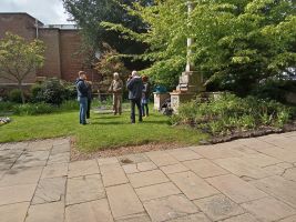 Ringing handbells in St Mary-le-Tower churchyard.