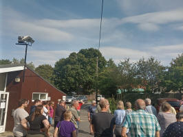 Rowan doing the draw outside Horringer Community Centre.