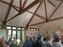 The tea being enjoyed in the hall. The tea being enjoyed in the hall.