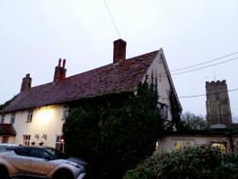 The tower at Pettistree behind the Greyhound.