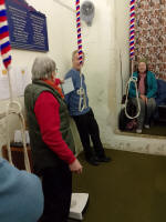 Mike Whitby receiving the band's birthday card for him from Mary Garner at Pettistree practice.