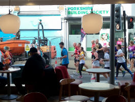 Runners in the Ipswich Half Marathon running past Costa Coffee whilst we were in there for post-ringing refreshments.