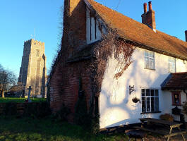 St Peter and Paul's church and the Greyhound Inn in Pettistree on Christmas Day morning.