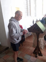 Guild Ringing Master Julian Colman doing the draw in Wickham Skeith church for the 6-bell Striking Competitions.