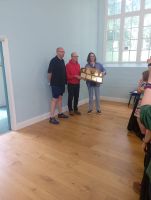 Suffolk Guild Ringing Master Julian Colman receiving the Ridgman Trophy from the judges Mark Eccleston and Vicky Wilby.