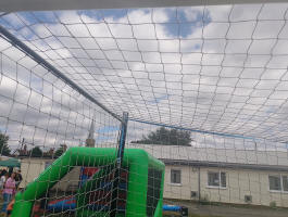 The tower of All Saints Wickham Market standing over proceedings at the football funday.