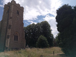 St Christopher's Willingale in the foreground, with the tower of St Andrew's between the trees in the background.