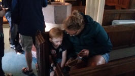 Alfie being read stories at Doddiscombleigh by Thirza de Kok.