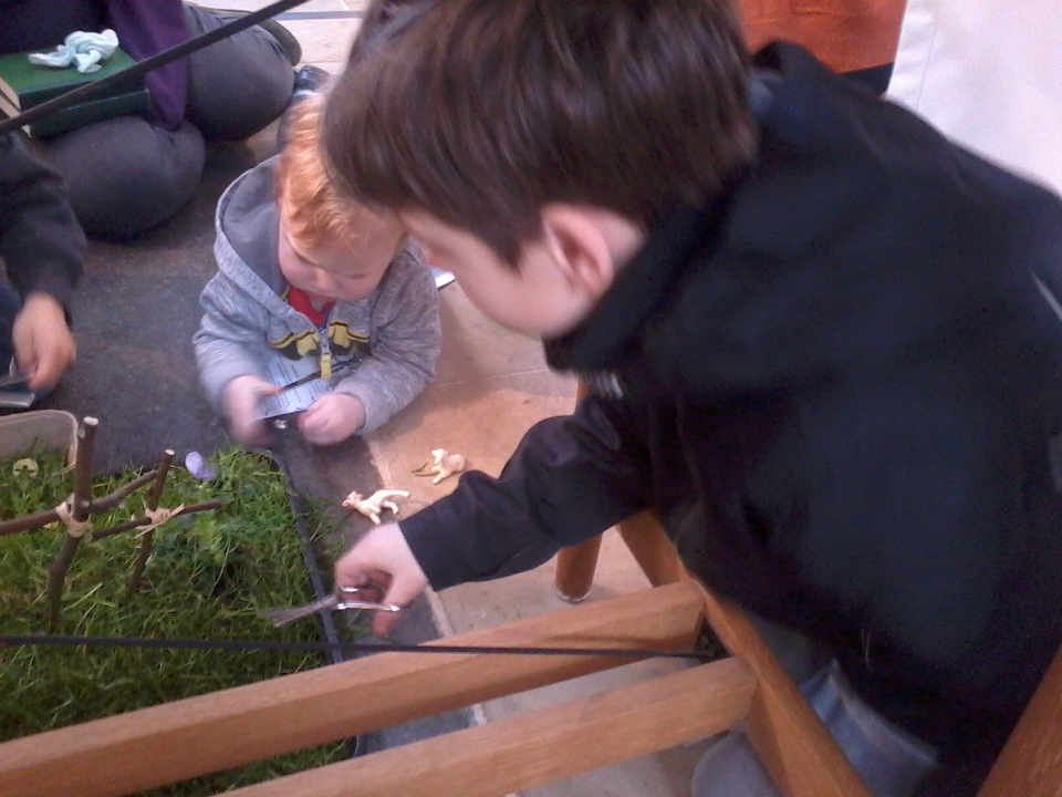 Alfie and Mason getting grass after church.