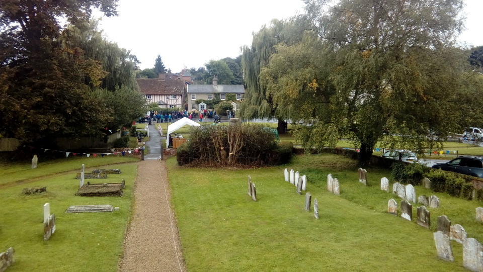 View of crowds in Grundisburgh waiting for Tour of Britain to come through, from window of ringing chamber.