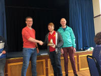  Neal Dodge collects the Lester Brett Trophy on behalf of the Great Barton band from Andrew Kelso & Brian Meads at Polstead Village Hall.