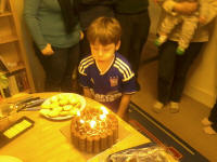 Mason blowing the candles out on his cake. Mason blowing the candles out on his cake.
