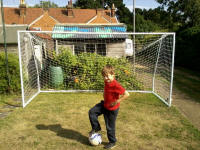 Mason in front of his newly constructed goalposts. Mason in front of his newly constructed goalposts.