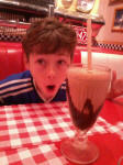 Mason with his 'small' milkshake at the diner. Mason with his 'small' milkshake at the diner.