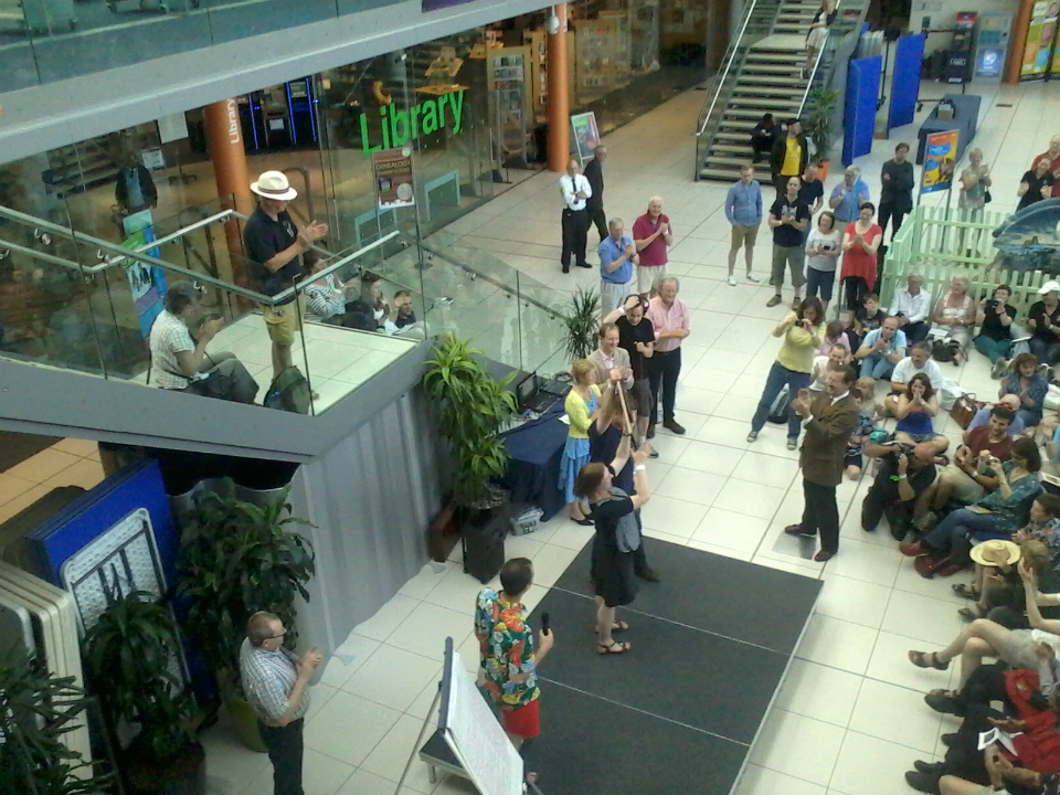 Katie Town & Rob Lee of the College Youths lift the Taylor Trophy.
