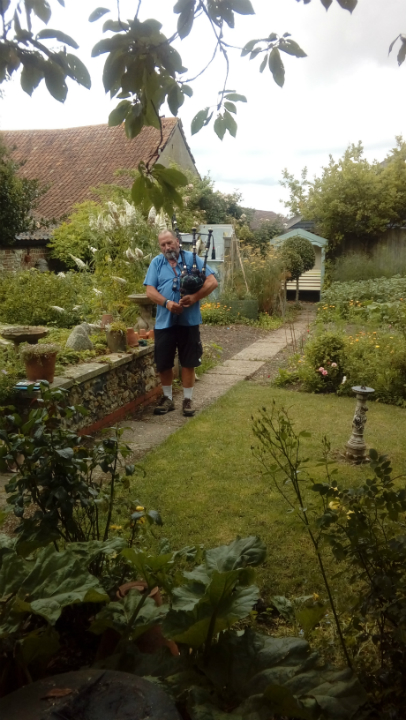 Ron playing the bagpipes at Offton BBQ.