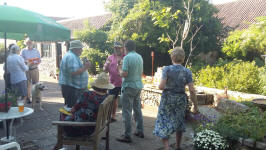Stephen Pettman, Jonathan Williamson & Brian Whiting ringing handbells at the Offton BBQ.