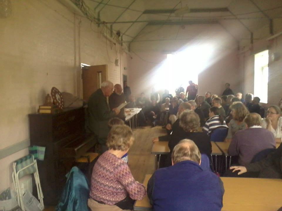 The judges John Girt and Roger Coley give the results at Monewden Village Hall.