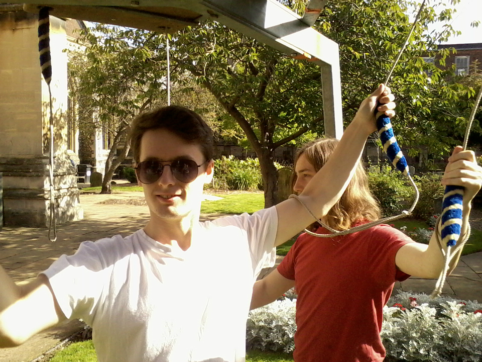 George & Colin Salter playing a form of ringing 'twister' on The Vestey Ring outside St Mary-le-Tower.