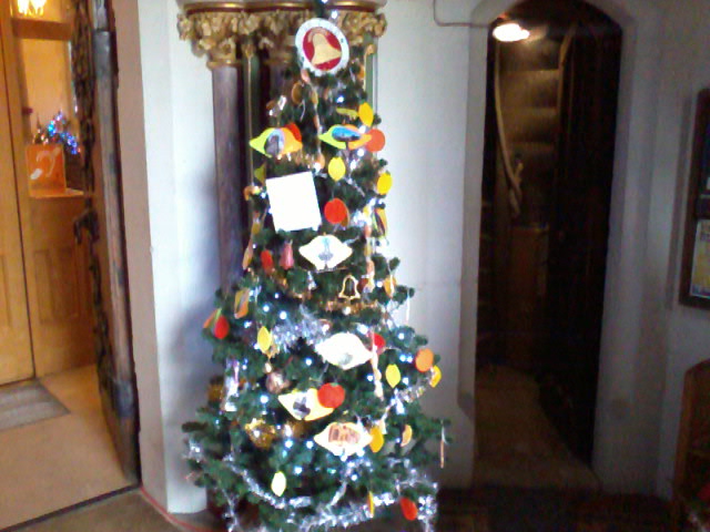 Ringers Christmas tree at bottom of stairs to ringing chamber at St Mary-le-Tower during Christmas Tree Festival.